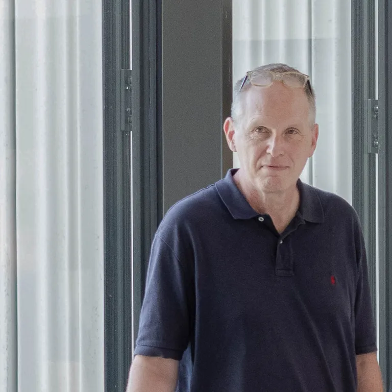 photo of Andreas Lüthi in front of a window